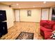 Finished basement featuring recessed lighting, red sectional couch, and laminate floors at 8394 Glen Highlands Dr, Indianapolis, IN 46236