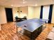 Basement game room with a ping pong table and a dining area offers space for recreation and leisure at 8394 Glen Highlands Dr, Indianapolis, IN 46236