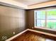 Bedroom featuring wood floors and a large window at 8394 Glen Highlands Dr, Indianapolis, IN 46236