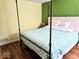 Bright bedroom with hardwood floors, a full-sized bed frame and natural light at 8394 Glen Highlands Dr, Indianapolis, IN 46236