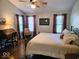 Bedroom with vaulted ceilings, natural light, desk, and king bed at 8394 Glen Highlands Dr, Indianapolis, IN 46236
