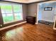 Bedroom featuring wood floors and a large window at 8394 Glen Highlands Dr, Indianapolis, IN 46236
