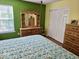 Bedroom with hardwood floors, furniture set, and natural light at 8394 Glen Highlands Dr, Indianapolis, IN 46236
