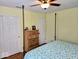 Bedroom with hardwood floors, furniture set, and natural light at 8394 Glen Highlands Dr, Indianapolis, IN 46236