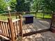 Inviting wooden deck with a fire pit, ideal for cozy evenings outdoors at 8394 Glen Highlands Dr, Indianapolis, IN 46236