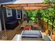 Covered deck with dining set and grill, perfect for outdoor meals and gatherings at 8394 Glen Highlands Dr, Indianapolis, IN 46236