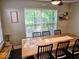 Dining room with large windows, natural light, and wood table at 8394 Glen Highlands Dr, Indianapolis, IN 46236
