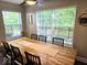 Spacious dining room with a large table perfect for Gathering meals and entertaining at 8394 Glen Highlands Dr, Indianapolis, IN 46236