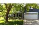 Charming front exterior with a well-kept lawn and attached two car garage at 8394 Glen Highlands Dr, Indianapolis, IN 46236