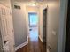 Hallway with wood floors and white trim at 8394 Glen Highlands Dr, Indianapolis, IN 46236