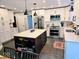 Bright kitchen features white cabinets, stainless steel appliances, and a large island with breakfast bar at 8394 Glen Highlands Dr, Indianapolis, IN 46236
