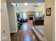 Inviting living room featuring a brick fireplace, hardwood floors, and ample natural light at 8394 Glen Highlands Dr, Indianapolis, IN 46236