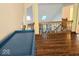 Open living room features hardwood floors, wooden banisters, and great views into the loft at 8394 Glen Highlands Dr, Indianapolis, IN 46236