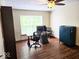 Home office with hardwood floors, a window with natural light, and a computer desk at 8394 Glen Highlands Dr, Indianapolis, IN 46236