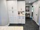 Large pantry with white cabinets and drawers for ample storage at 8394 Glen Highlands Dr, Indianapolis, IN 46236