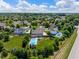 Spacious suburban home featuring a large backyard, in-ground pool, and mature trees at 8754 Lily Ct, Zionsville, IN 46077