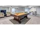 Finished basement featuring a billiard table and foosball table, ideal for recreation and social gatherings at 8754 Lily Ct, Zionsville, IN 46077