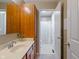 This bathroom includes a single sink vanity and a shower/tub combo at 8754 Lily Ct, Zionsville, IN 46077