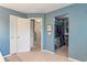 This bedroom includes access to a hallway and a large walk-in closet at 8754 Lily Ct, Zionsville, IN 46077