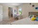 A bright bedroom includes a window desk and a bed at 8754 Lily Ct, Zionsville, IN 46077