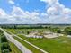 Aerial shot of a vibrant community park with playground, walking paths, and green space at 8754 Lily Ct, Zionsville, IN 46077