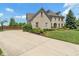 Spacious two-story home featuring a classic brick facade, well-manicured landscaping and large driveway at 8754 Lily Ct, Zionsville, IN 46077