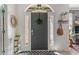 Inviting foyer with an arched doorway, decorative mirror and coat rack at 8754 Lily Ct, Zionsville, IN 46077
