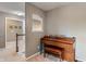 Hallway with carpet flooring and decorative wall art that leads to the upper level at 8754 Lily Ct, Zionsville, IN 46077
