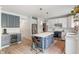 This eat-in kitchen features stainless appliances, an island with bar stool seating, and lots of cabinet space at 8754 Lily Ct, Zionsville, IN 46077