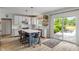 Bright eat-in kitchen features a large island with seating and sliding glass doors to the backyard at 8754 Lily Ct, Zionsville, IN 46077