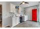 Clean laundry room with cabinets, utility sink, tile floors, and washer/dryer at 8754 Lily Ct, Zionsville, IN 46077