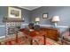 Bright office with a desk, fireplace, and view of the exterior at 8754 Lily Ct, Zionsville, IN 46077