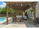 Covered patio with an outdoor seating area, providing a comfortable space to relax and entertain at 8754 Lily Ct, Zionsville, IN 46077