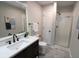 Elegant bathroom with a modern vanity, sleek fixtures, and a glass-enclosed shower at 9323 Doubloon Rd, Indianapolis, IN 46268