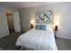 Inviting bedroom with a comfortable queen-sized bed, soft carpet, and modern decor at 9323 Doubloon Rd, Indianapolis, IN 46268