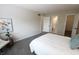 Bright bedroom with a queen bed, stylish accents, and ample closet space at 9323 Doubloon Rd, Indianapolis, IN 46268