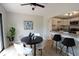Bright dining area adjacent to the kitchen features a modern light fixture and slider to the deck at 9323 Doubloon Rd, Indianapolis, IN 46268