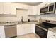 Beautiful kitchen features white cabinetry, stainless steel appliances and granite countertops at 9323 Doubloon Rd, Indianapolis, IN 46268