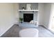 Cozy room featuring carpet and a painted brick fireplace at 9323 Doubloon Rd, Indianapolis, IN 46268