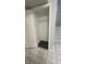 Neat storage closet featuring wood floor, wire shelf, and white walls, providing ample space at 9458 Fordham St, Indianapolis, IN 46268