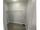 Empty walk-in closet ready for organization, featuring a wire rack for storage at 9458 Fordham St, Indianapolis, IN 46268