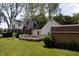 Exterior showcasing a wooden deck, fenced yard, and the back of a two-story house with white siding and brick accents at 980 W Poplar St, Zionsville, IN 46077