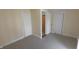 Neutral bedroom with light carpet, multiple closets, and natural light at 980 W Poplar St, Zionsville, IN 46077