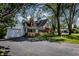Lovely home with brick and siding exterior, paved driveway, attached garage, and well-maintained lawn at 980 W Poplar St, Zionsville, IN 46077