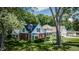Charming homes with well-maintained lawns and mature trees in a residential area at 980 W Poplar St, Zionsville, IN 46077