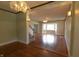 Spacious living room with hardwood floors, a bay window, natural light, and classic light fixtures at 980 W Poplar St, Zionsville, IN 46077