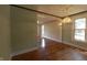 Open-concept living space with hardwood floors, neutral paint colors, and recessed lighting at 980 W Poplar St, Zionsville, IN 46077