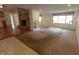 Bright living room featuring a fireplace, carpeted floors, and natural light from the windows at 980 W Poplar St, Zionsville, IN 46077