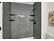 Bathroom featuring sleek gray subway tile in the shower with built in shelving at 9936 Waterside Dr, Noblesville, IN 46060