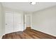 This bedroom features a closet and attractive wood-look laminate flooring at 9936 Waterside Dr, Noblesville, IN 46060